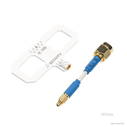 Gold RF connector pigtail close-up shown beside white Moxon antenna panel
