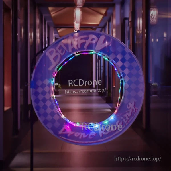 BETAFPV racing circle gate with LED strip threaded through inner-loop loopholes, glowing ring for indoor FPV track