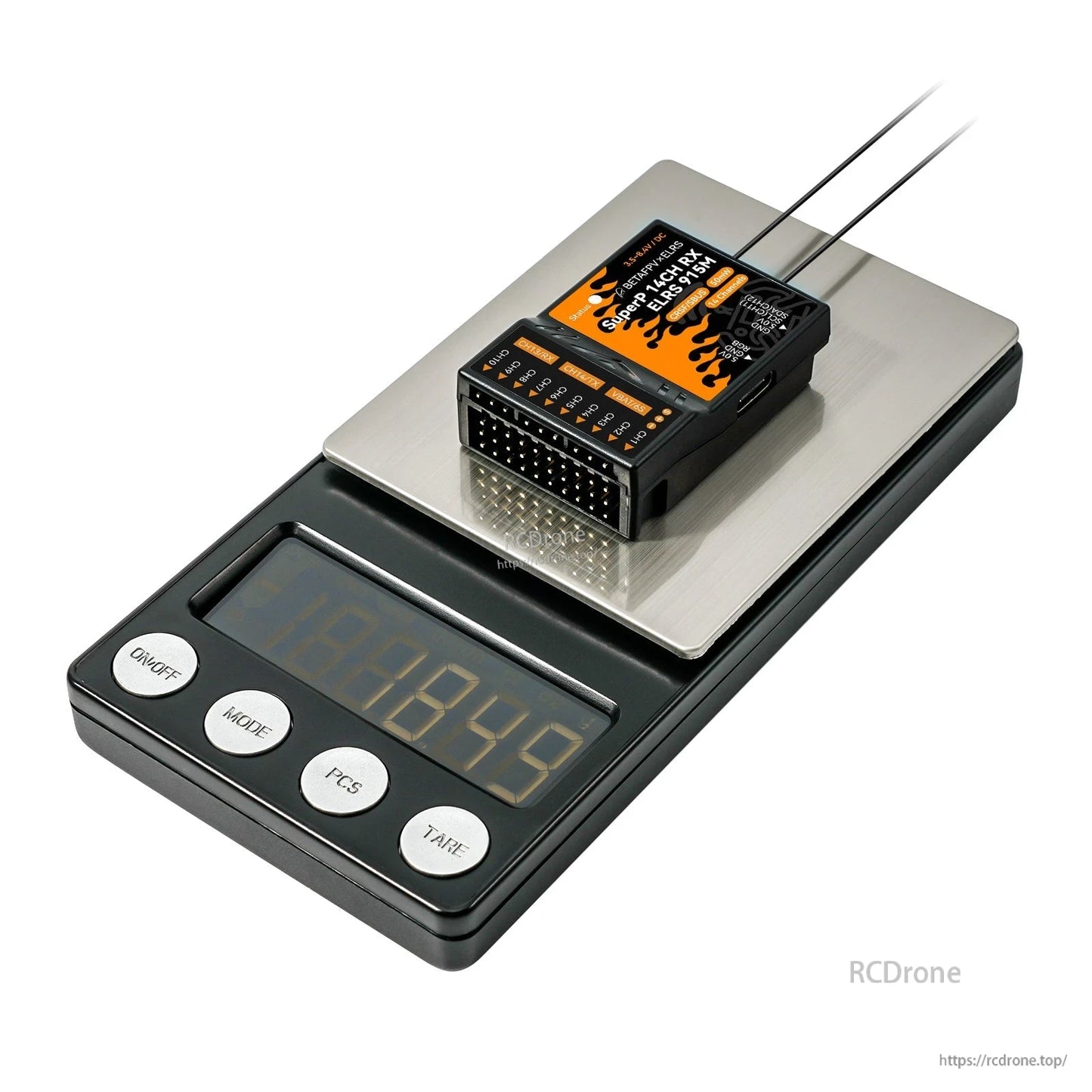Angled view of receiver on digital scale platform, showing front pin header and weight reference
