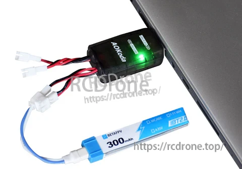 Adapter lead connected between a PH2.0-style charger port and a BT2.0 1S battery pack during charging