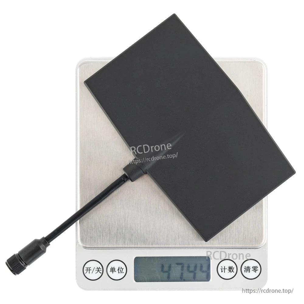 Antenna shown on digital scale with display reading 47.44 g, cable and connector visible