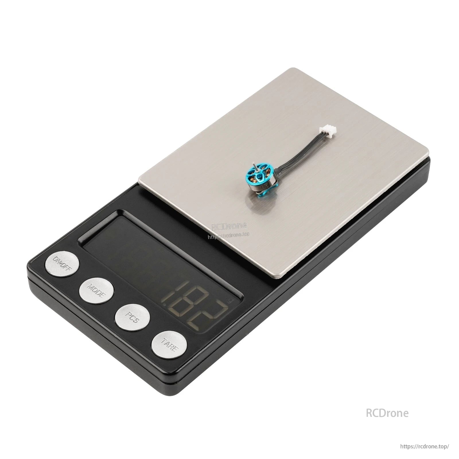 Blue micro brushless motor on digital scale, weight display showing 1.82 g with lead wire and connector