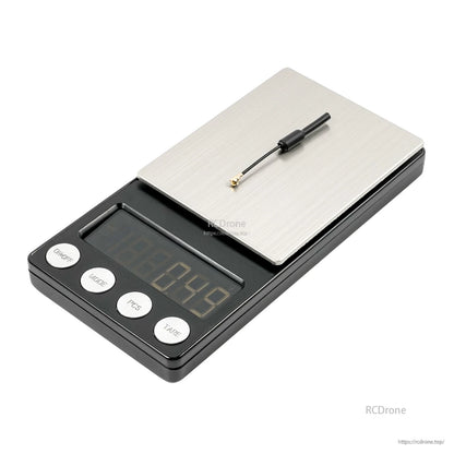 BetaFPV 5.8G VTX antenna on digital scale for weight reference, U.FL connector and 50mm lead visible