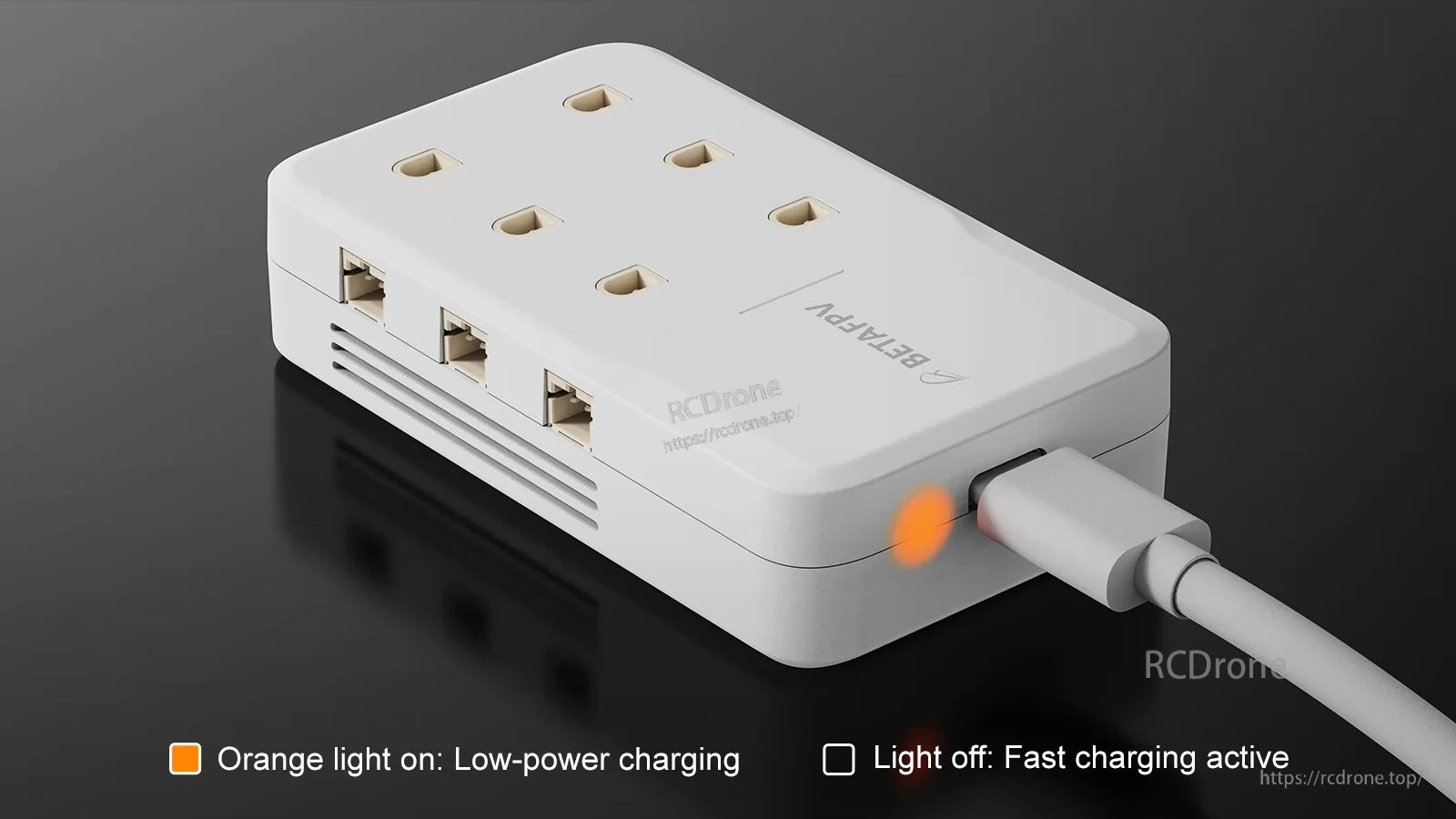 Charger connected via USB‑C with orange LED indicating low-power charging or fast charging status
