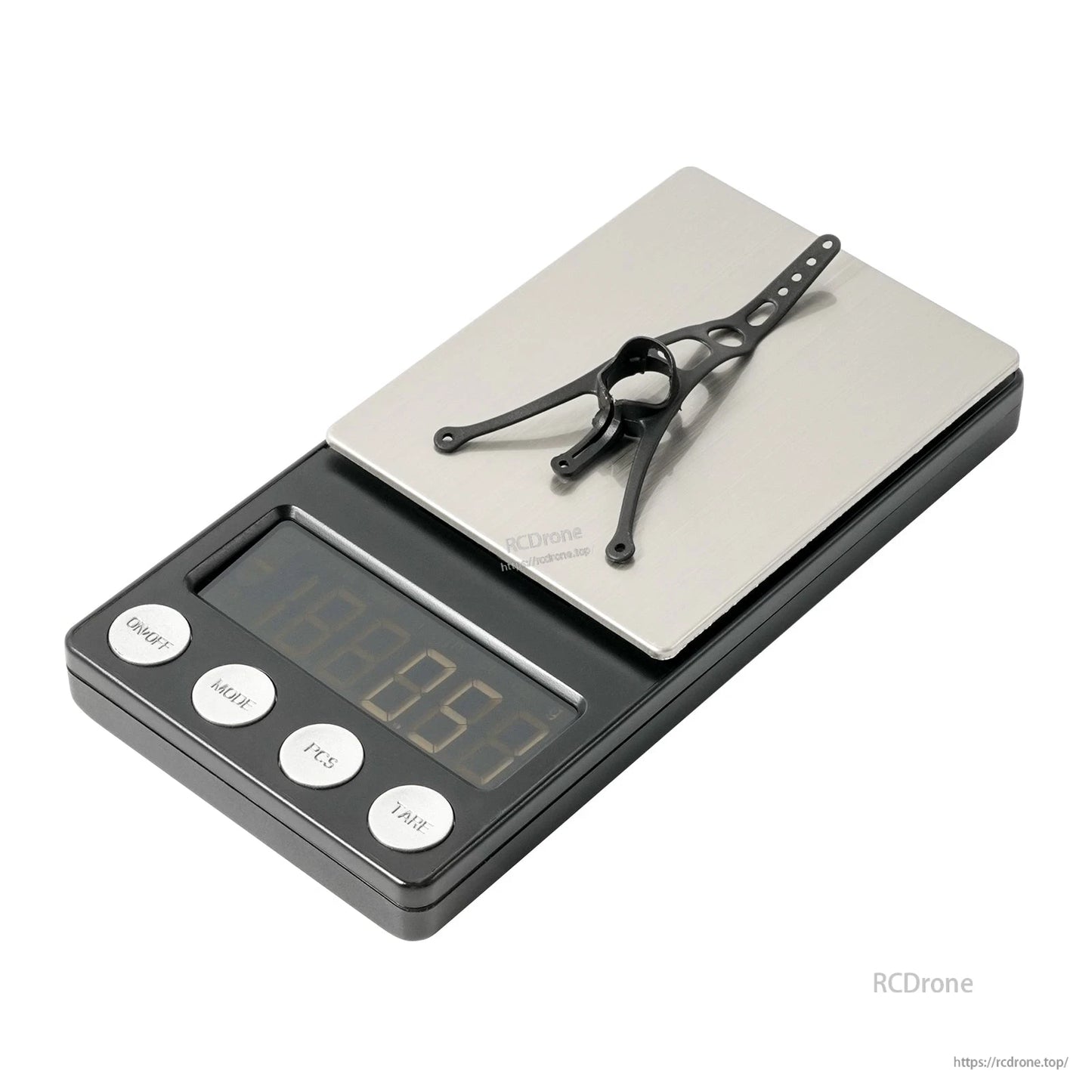 Black canopy bracket placed on a digital scale to show lightweight design and size