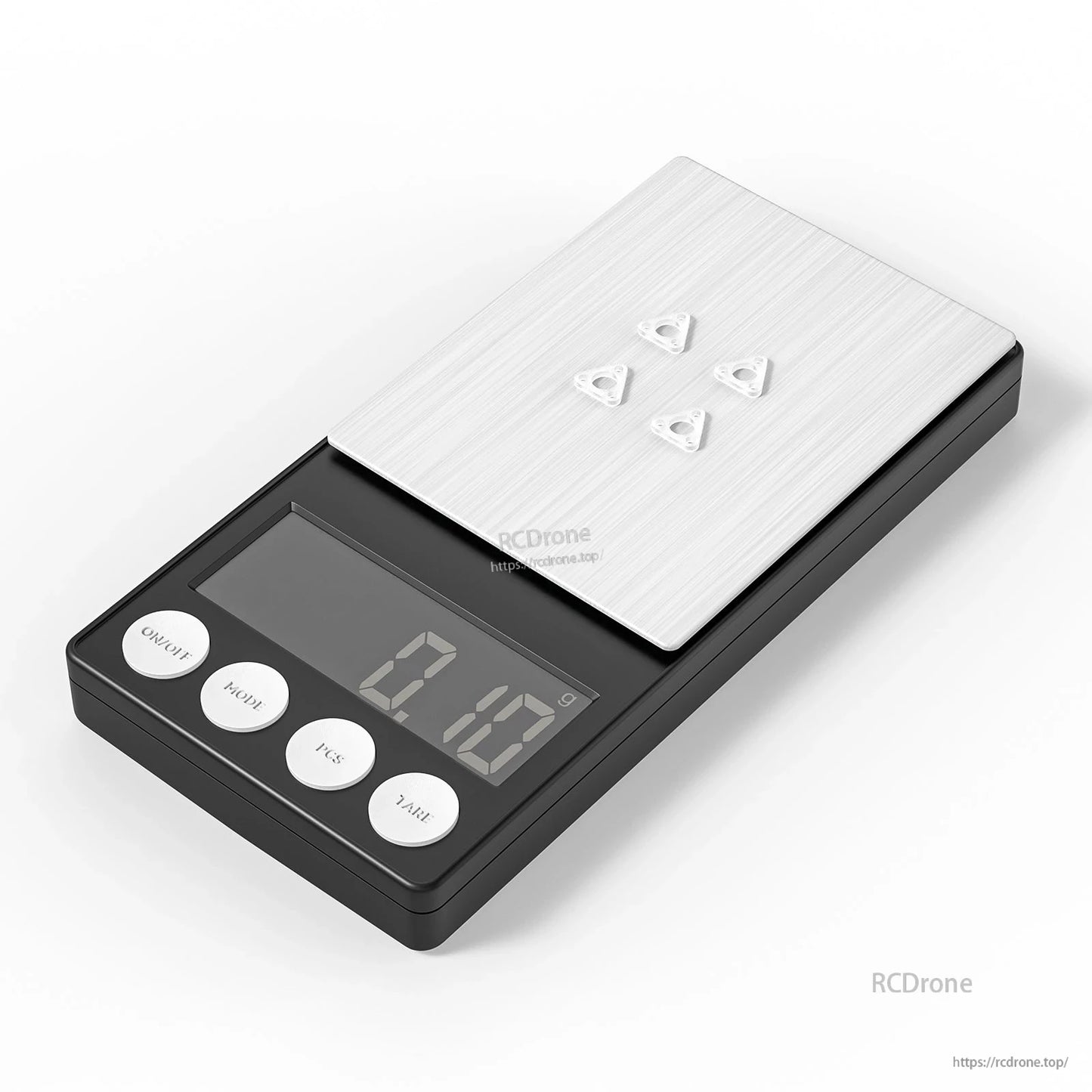 Four motor gaskets on digital scale showing 0.13g total weight