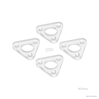Clear motor gaskets, angled view showing thickness and three mounting holes