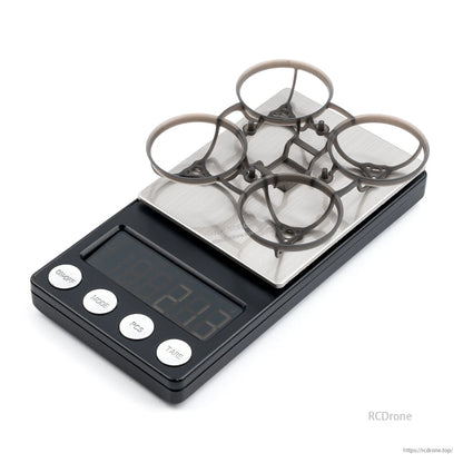 BetaFPV Air65 Champion 65mm brushless whoop frame placed on digital scale to show weight