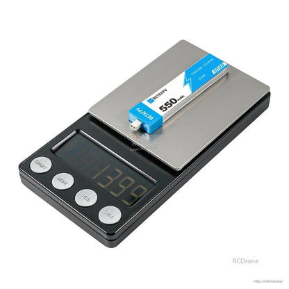 Single 550mAh BT2.0 1S LiHV battery on digital scale, close-up of BT2.0 connector and pack size