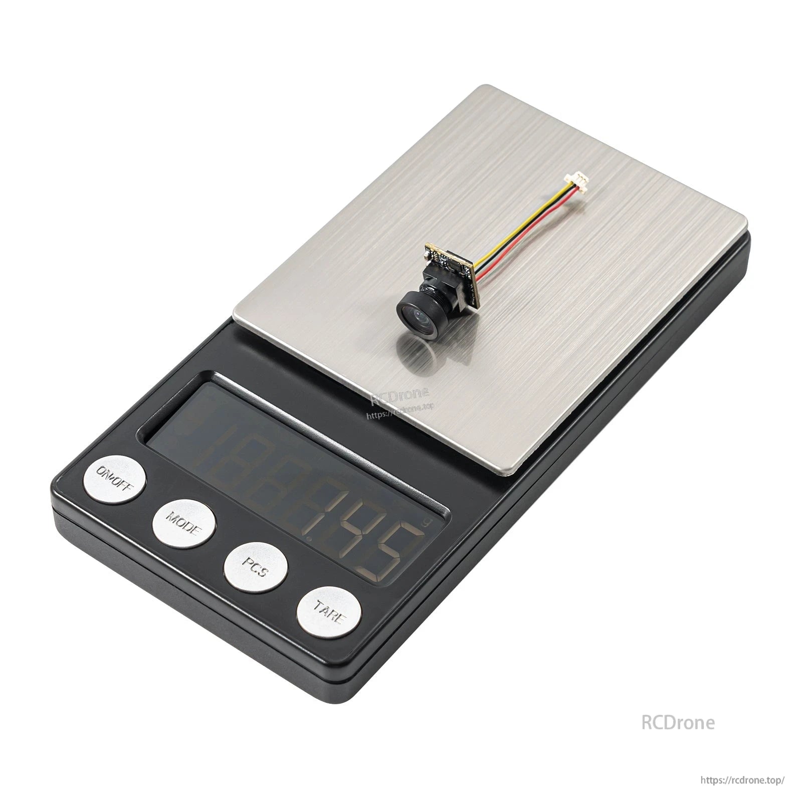 Micro FPV camera with wired connector placed on a digital scale for weight reference