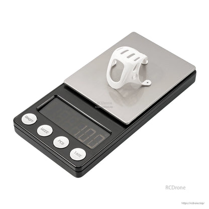 BetaFPV canopy placed on a digital scale platform for weight reference