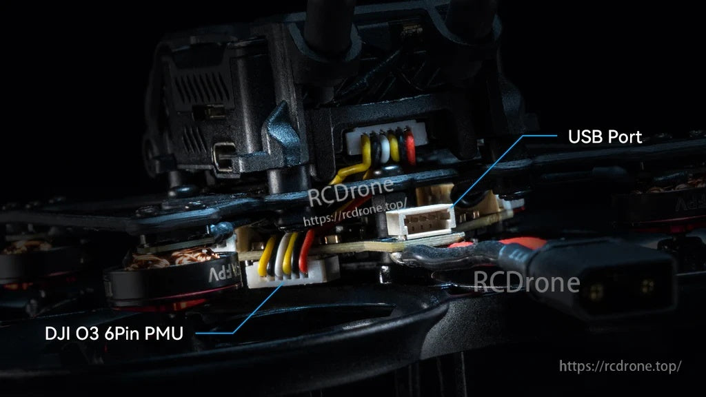 Installed AIO flight controller in a frame highlighting rear USB port and DJI O3 6-pin PMU connector