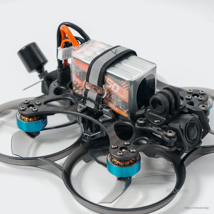 BetaFPV LAVA Series 4S 850mAh LiPo battery strapped onto an FPV quad frame with power lead visible