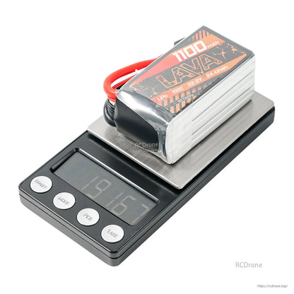 LAVA 6S 1100mAh LiPo battery on digital scale for weight check, top label visible