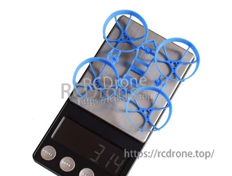 Blue BetaFPV Meteor65 PP whoop frame on digital scale showing 3.14g weight