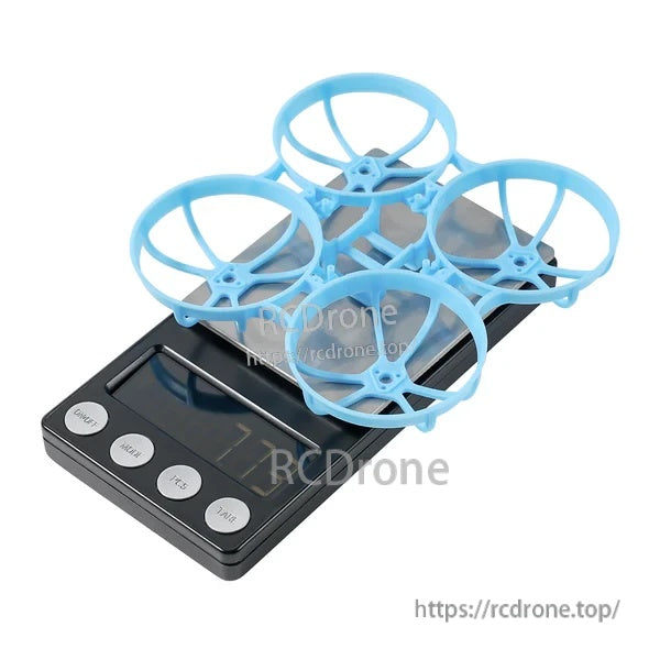 Blue Meteor75 Pro whoop frame on a digital scale, highlighting the lightweight 7.73g build