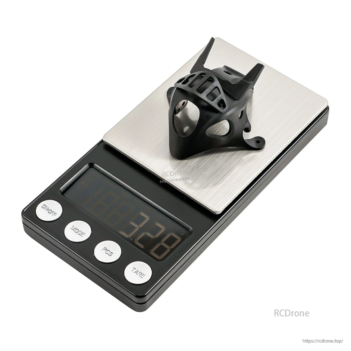 Black micro FPV canopy on digital scale, weight display reading 3.28