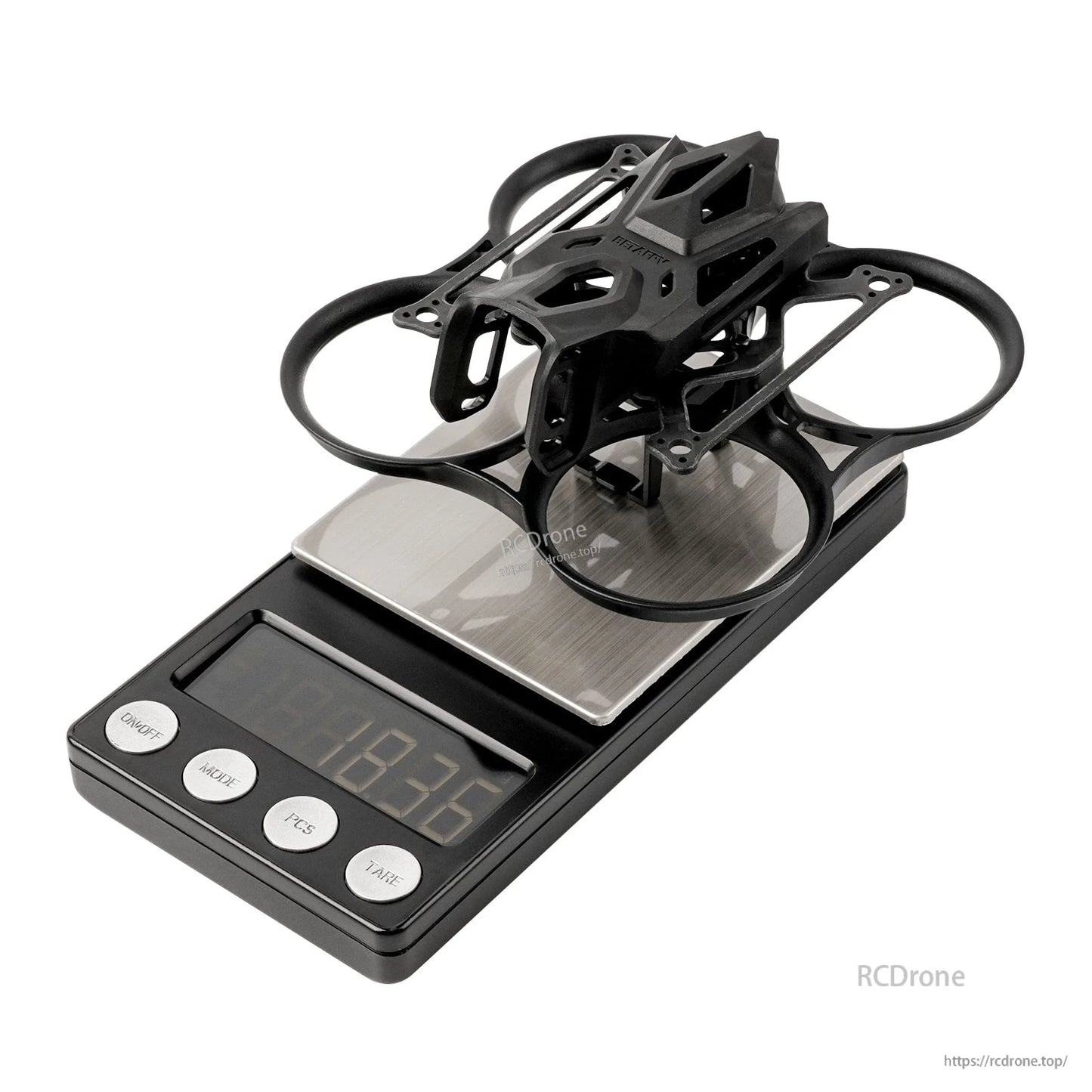 BetaFPV Pavo Femto 75mm whoop frame assembled on digital scale with PA12 ducts and top cage