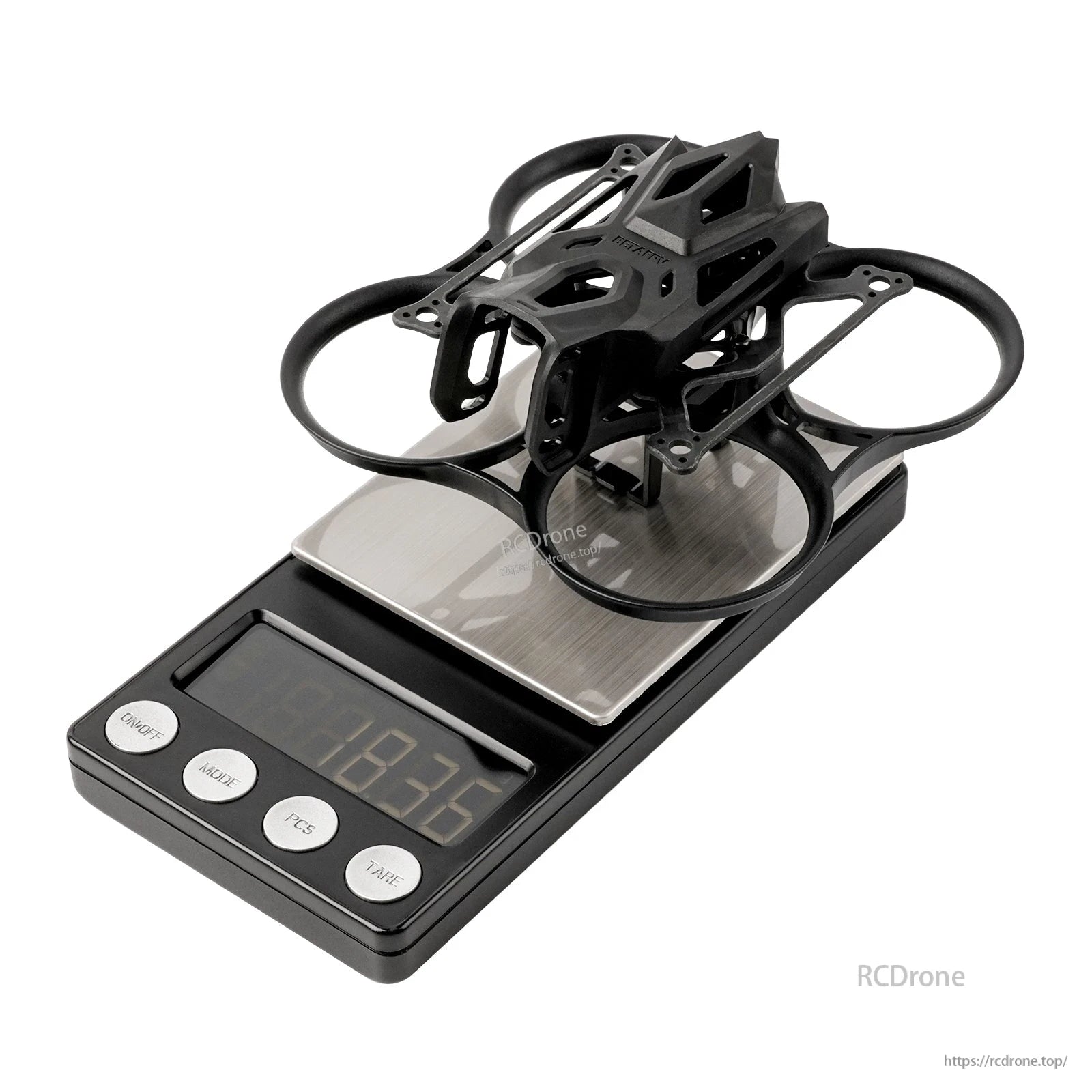 BetaFPV Pavo Femto 75mm whoop frame assembled on digital scale with PA12 ducts and top cage
