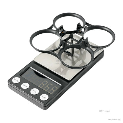 PA12 duct ring frame on digital scale, angled view showing four ducts and center mounting area
