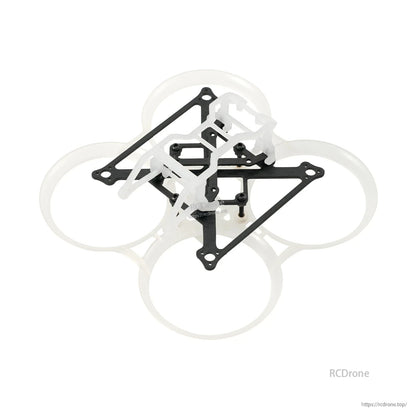 White duct whoop frame with camera mount canopy installed and carbon top plate, angled view