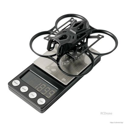 BetaFPV Pavo Pico II brushless whoop frame with canopy on digital scale, black ducted frame