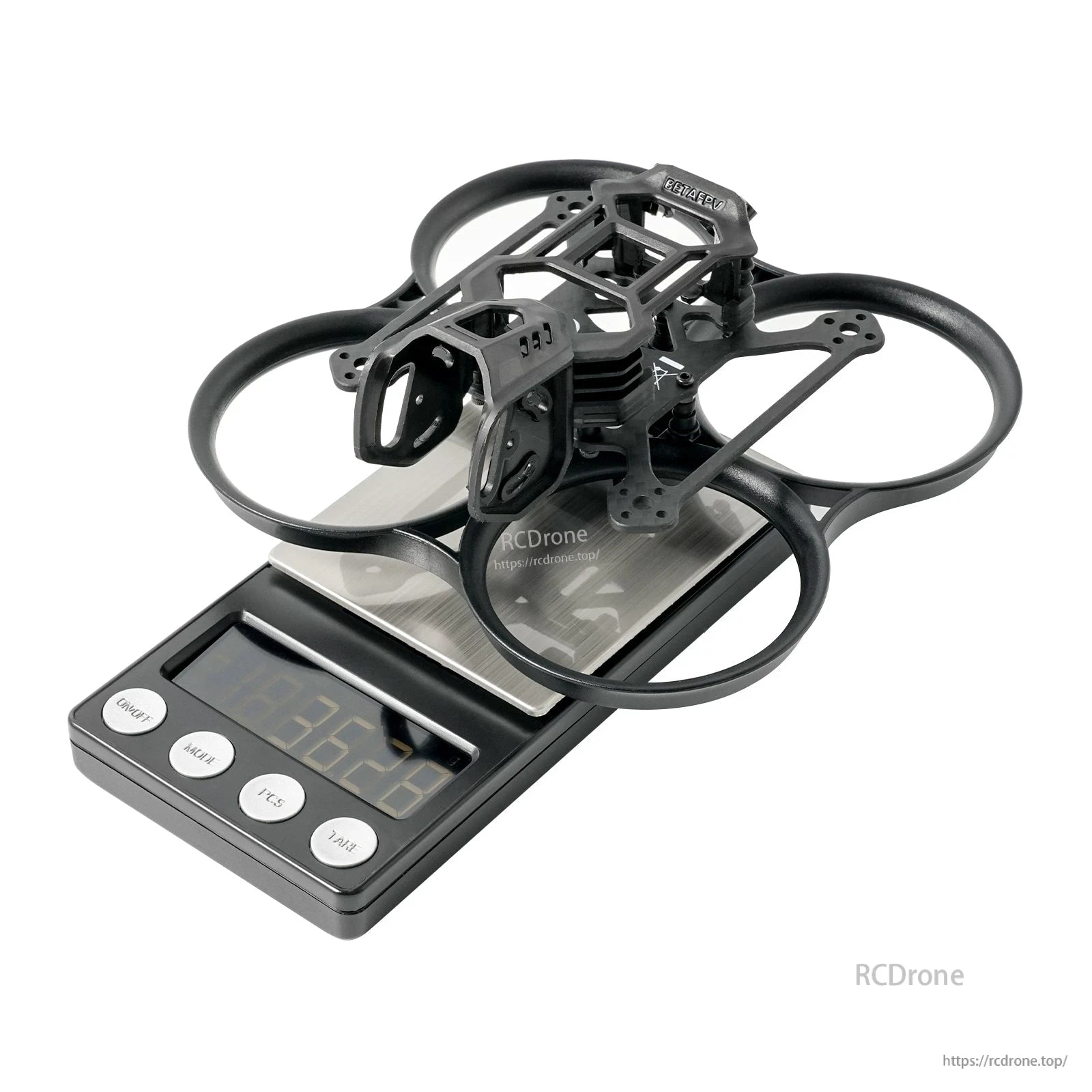 Gray assembled whoop frame on scale showing 38.2 g weight, angled top view