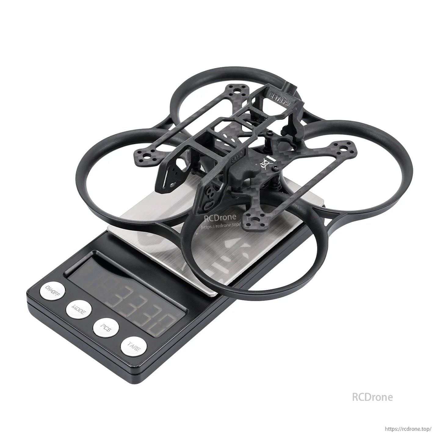 Black whoop frame on digital scale showing weight 33.7 g, angled top view