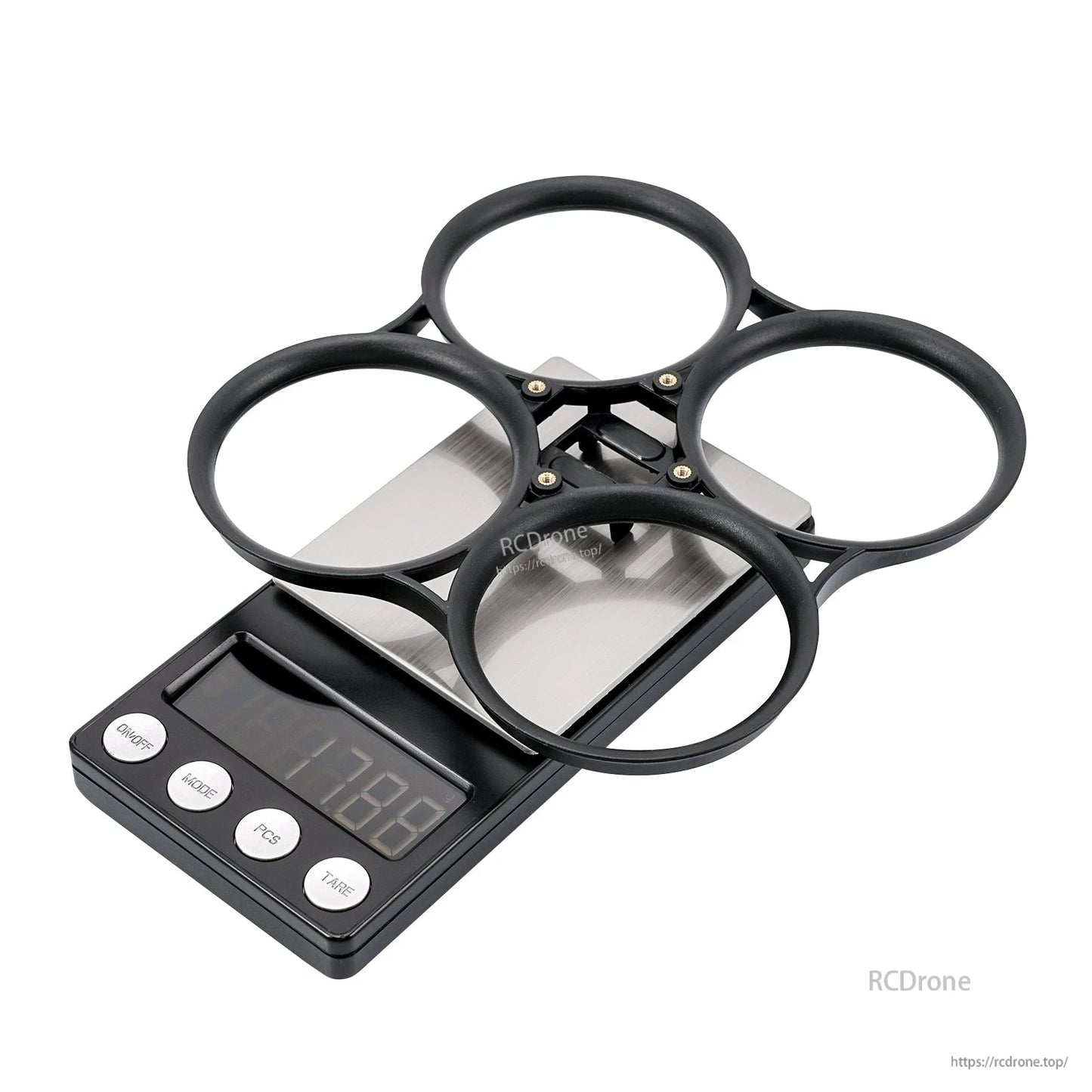 Black bumper ring on scale showing 17.8 g weight, angled view