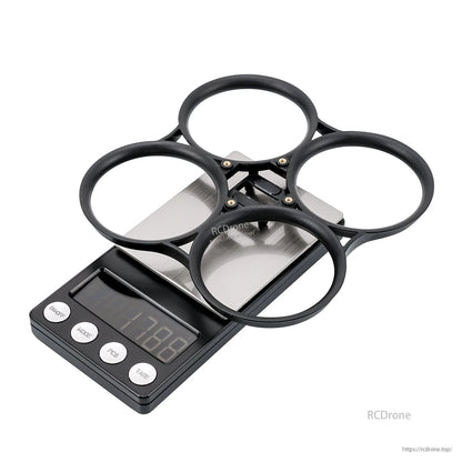Black bumper ring on scale showing 17.8 g weight, angled view
