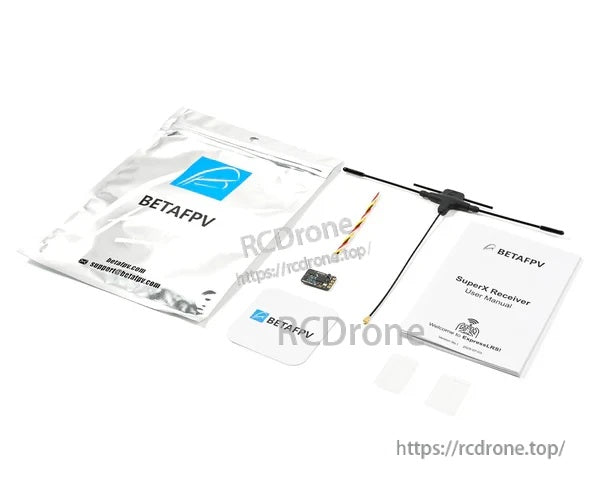 BetaFPV SuperX receiver kit contents with packaging, antenna, manual, and small mounting pads or accessories