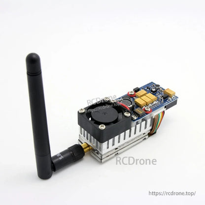 Side angle showing cooling fan on heatsink and RP-SMA antenna mounted on the transmitter