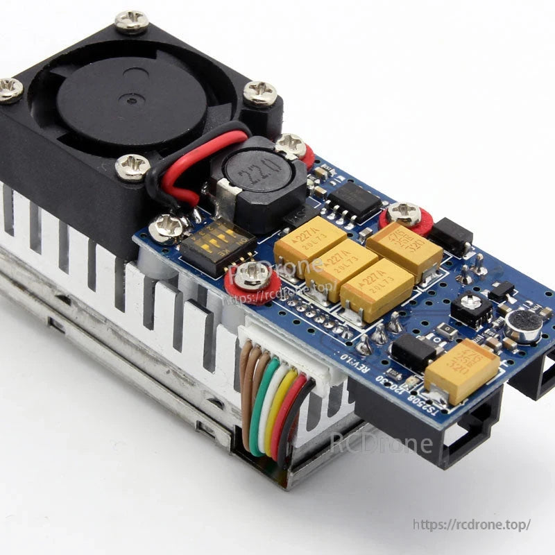 FPV transmitter PCB close-up showing capacitors, inductor and multicolor wire harness connection