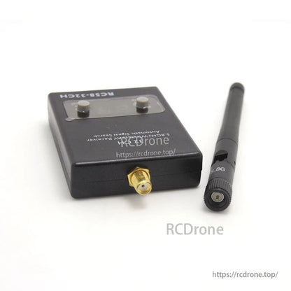 Close-up of receiver SMA antenna connector with antenna removed, showing threaded RF port