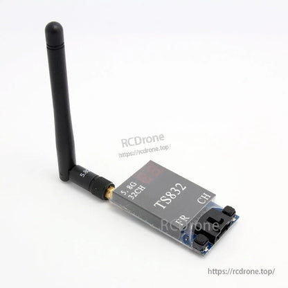 Boscam TS832 FPV video transmitter angled view with 5.8GHz antenna attached and channel display