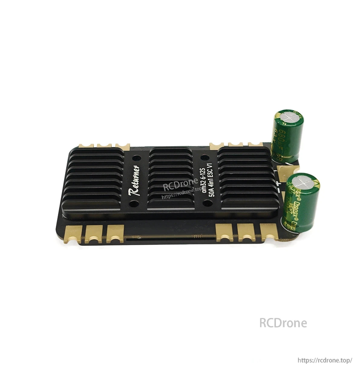BrotherHobby Returner 4-in-1 drone ESC with black heatsink and two green electrolytic capacitors