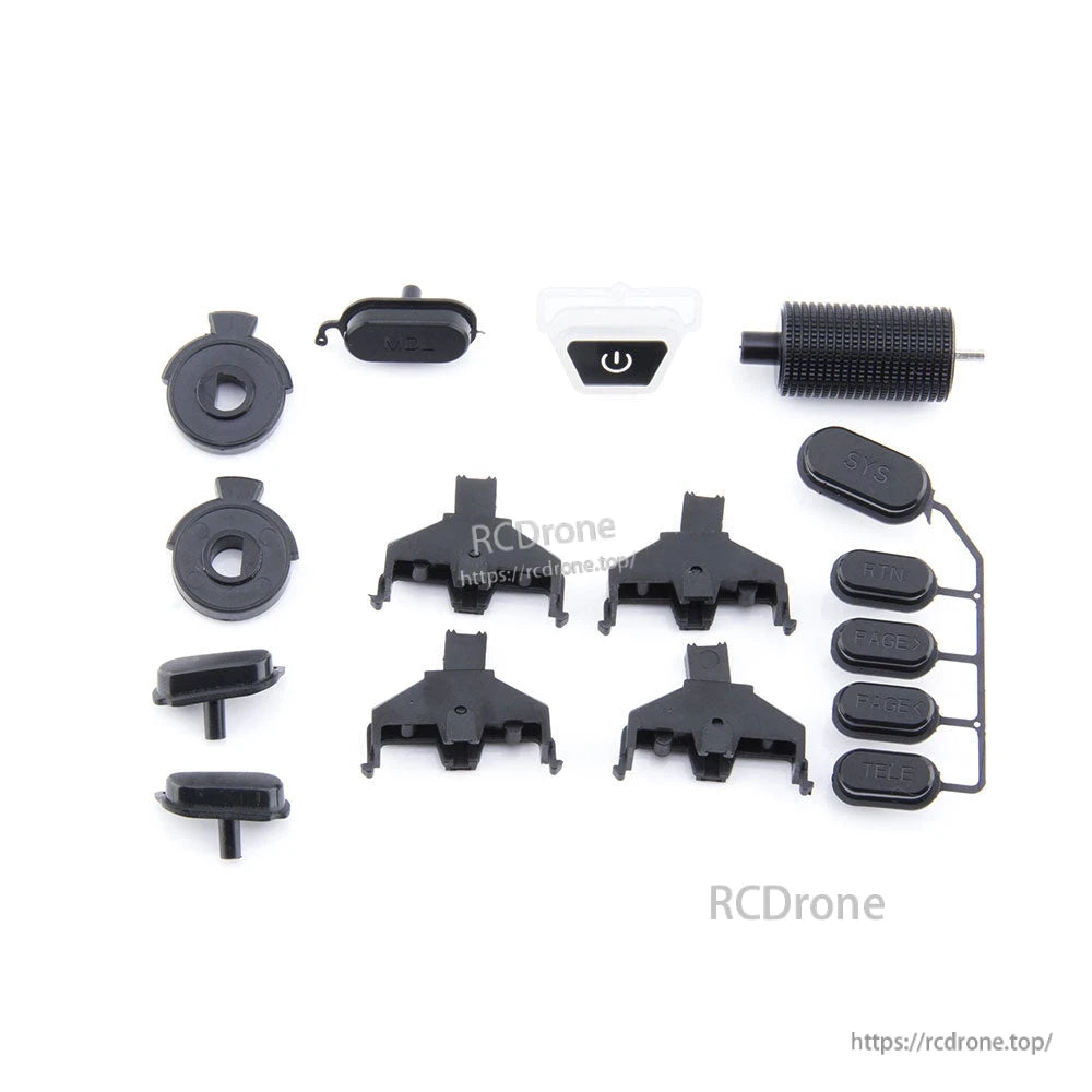 Button set parts laid out for RC radio transmitter, including power switch, trim keys and grip pieces