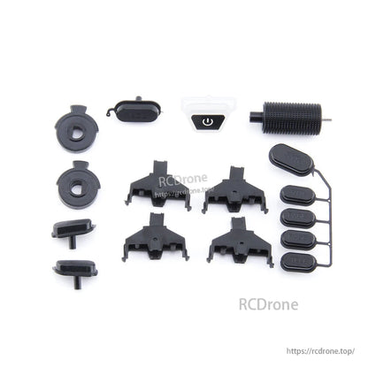 Button set parts laid out for RC radio transmitter, including power switch, trim keys and grip pieces