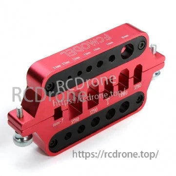 Angled view of red CNC aluminum soldering station holder with multiple connector slots and clamping screws