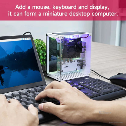 Desktop use setup with cube case beside laptop, keyboard and mouse, showing mini PC workstation example
