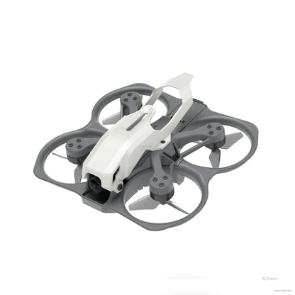 Angled top view of the Protos micro FPV drone showing canopy, ducts, motors and camera housing