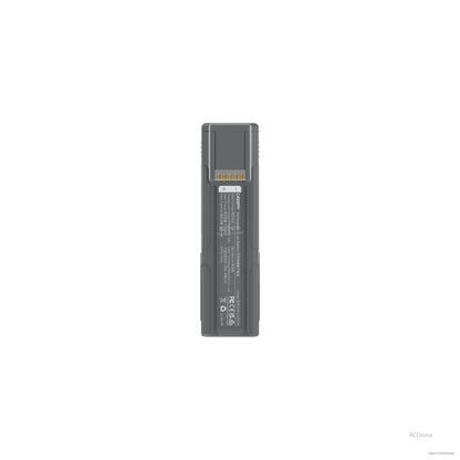 Top-down view of battery showing contact pins and specification label panel on the back