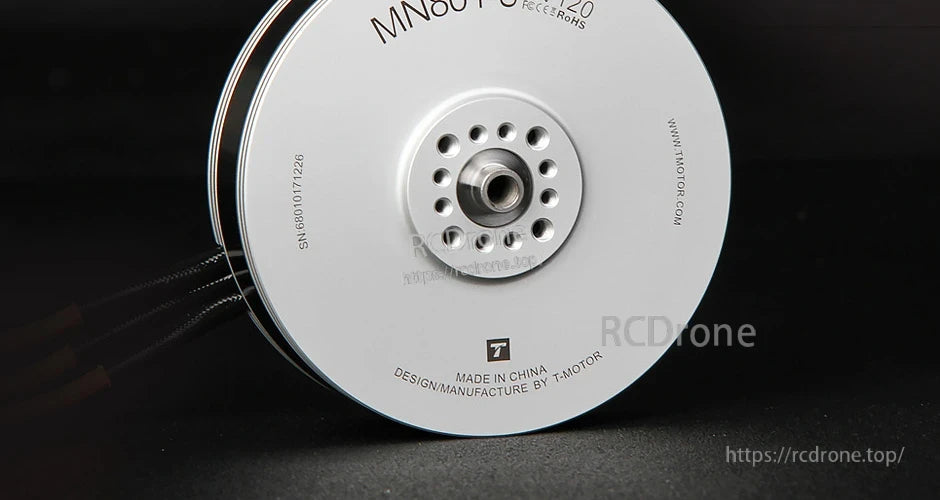 Close-up of T-Motor MN8017 brushless motor base with central shaft mount and ventilation holes, MN8017 KV120 label