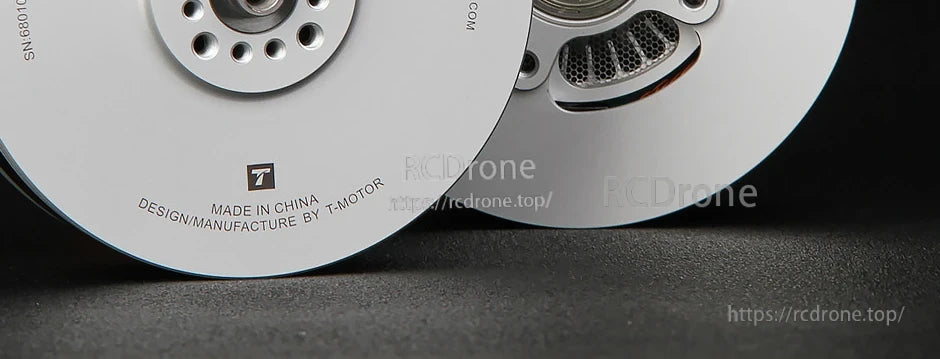 Close-up of T-Motor brushless motor end caps with machined metal finish and mounting holes