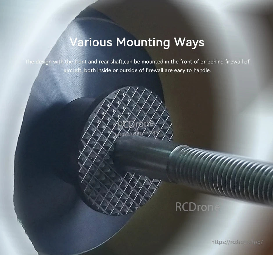 Close-up of a T-Motor aircraft motor shaft with knurled mount plate installed through a firewall for flexible mounting.