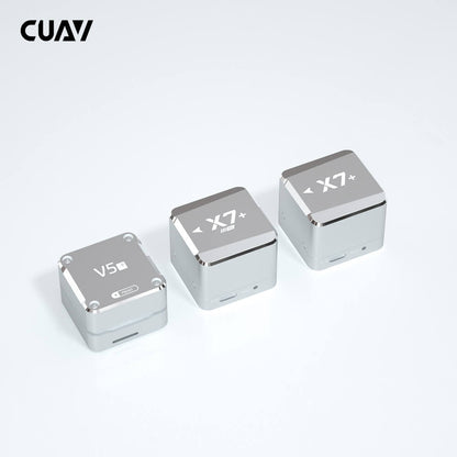 CUAV X7+ core flight controller modules in silver metal cases, with two X7+ units and a V5+ unit