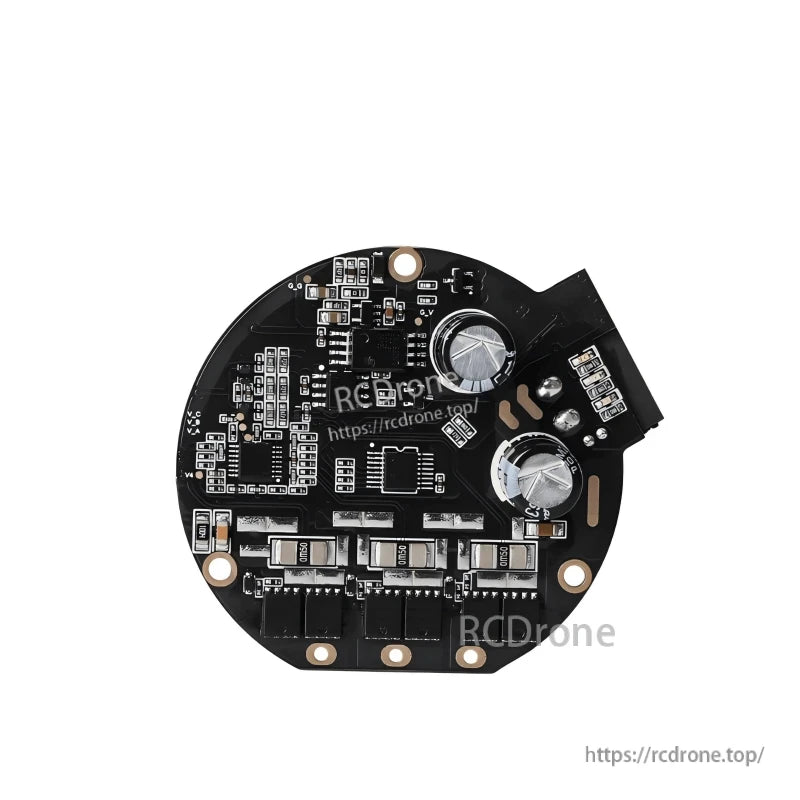 Reverse side of brushless motor controller board showing two large capacitors, power components, and connector end