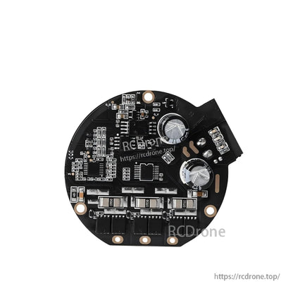 Reverse side of brushless motor controller board showing two large capacitors, power components, and connector end