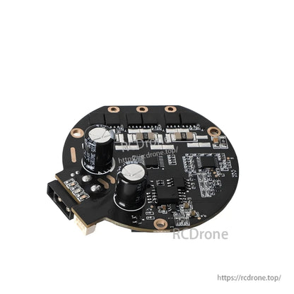 Angled back view highlighting two electrolytic capacitors and power stage components on the controller board