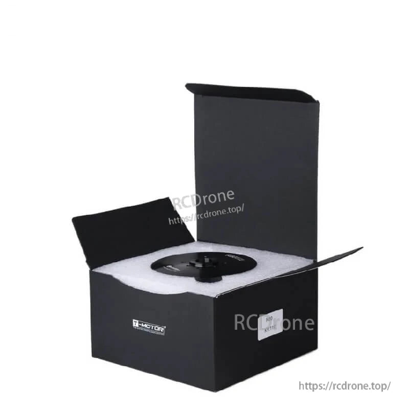 Motor shown seated in foam inside black retail box, packaging presentation view